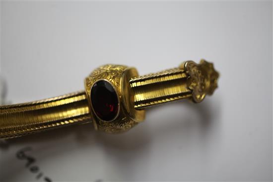 A Victorian gold and garnet snakelink slide action bracelet, gross 18 grams.